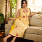 Yellow and white zebra-striped hand block printed sleeveless vintage luxe dress with maroon bird motifs and matching accents for a bold, elegant statement look.
