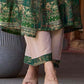 Rich bottle green printed Angrakha with a finely hand-embroidered neckline and soft beige accents.