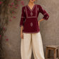 Graceful maroon hand block print top featuring timeless paisley motifs, delicate borders, and an elegant V-neck silhouette, crafted for effortless everyday sophistication.