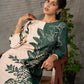 Bottle green and beige half and half dress with raglan sleeves and transitioning floral motifs.