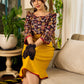 Mustard Kalamkari dress with an asymmetrical yoke and puffed sleeves.