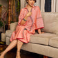 Peach dress featuring delicate Madhubani painting and graceful flared sleeves.