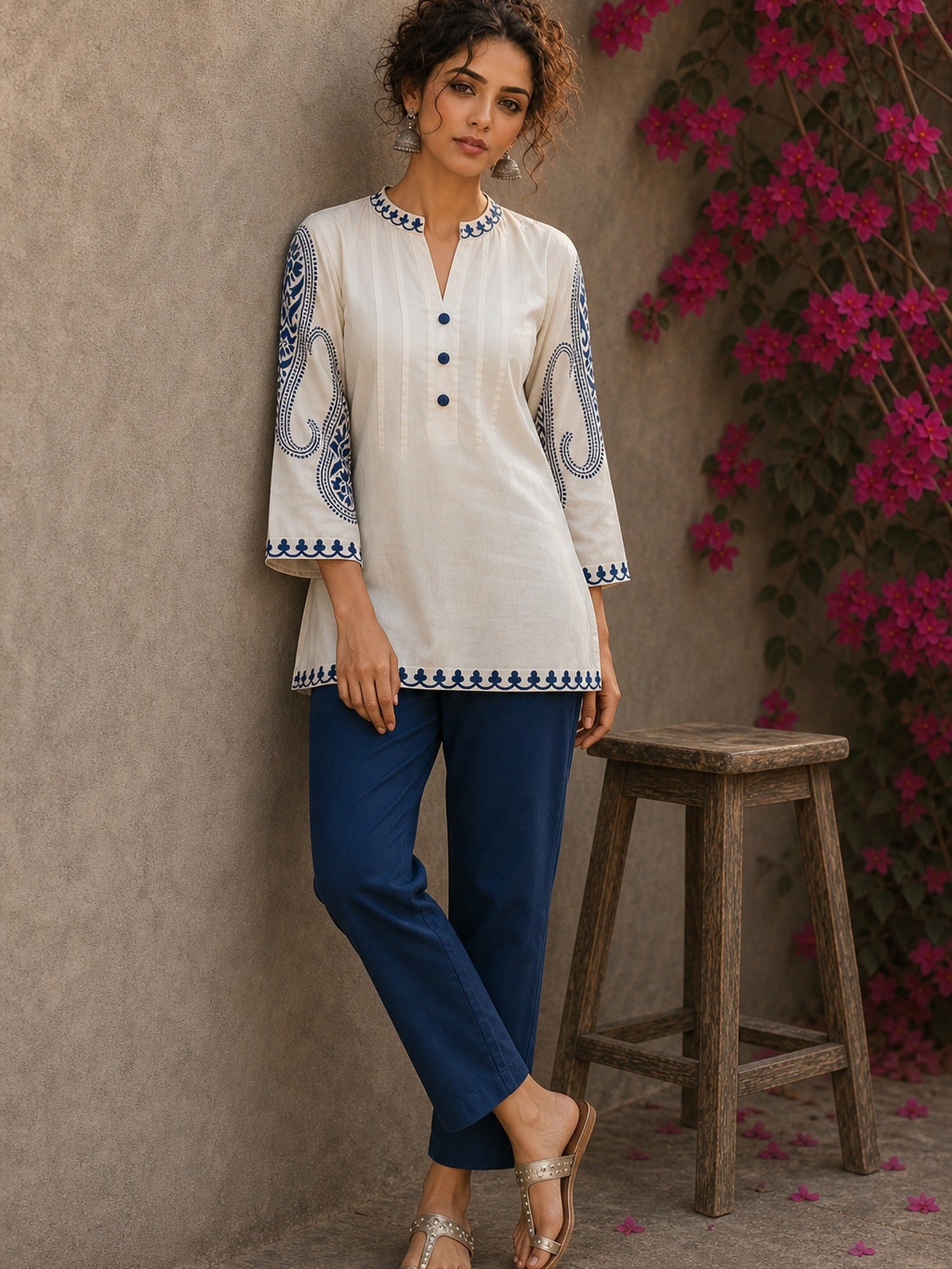 Elegant ivory hand block print top featuring intricate navy blue paisley sleeves, refined contrast detailing, and graceful pintucks, blending artisanal craftsmanship with timeless everyday sophistication.