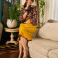 Mustard Kalamkari dress with an asymmetrical yoke and puffed sleeves.