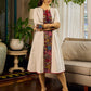 White and black striped dress with Kalamkari panel and tie-up neckline.