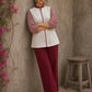 Chic off-white top featuring intricate hand block print sleeves in a vibrant red, complemented by a matching central decorative trim.