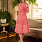 Peach and red block print stripe-floral shirt dress with fusion hand block printed stripes and jaal, a notch collar, and coordinated red accents for a vibrant, contemporary look.