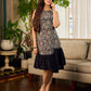 Stunning black Kalamkari overlap dress featuring a chic asymmetrical gathered hem.