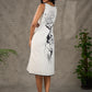 Timeless monochrome dress with statement flower print.