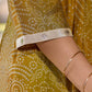 Exquisite yellow Bandhani printed kurta with a delicate off-white tissue overlay and refined accents.