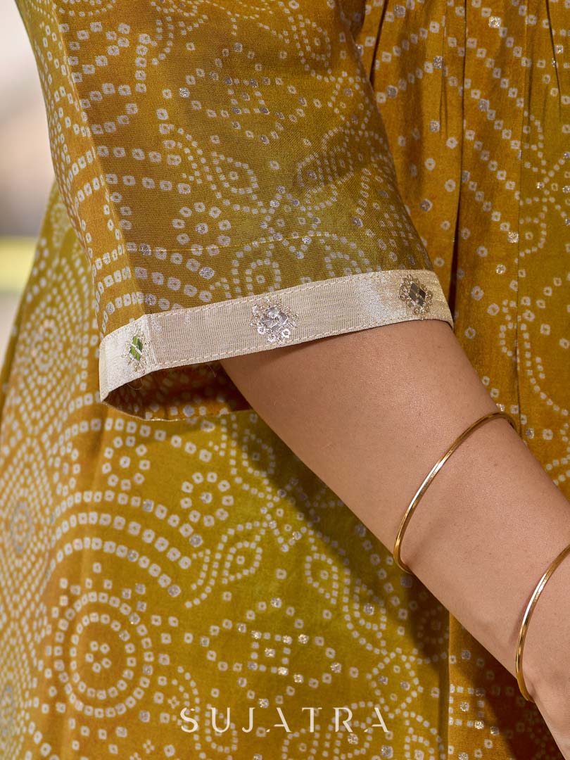 Exquisite yellow Bandhani printed kurta with a delicate off-white tissue overlay and refined accents.