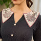 Timeless black stripes accented with exquisite hand-painted Madhubani on collars and cuffs