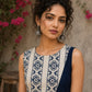 Contemporary off white and navy hand block print top featuring striking geometric motifs, an asymmetric layered silhouette, and effortless elegance
