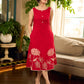Vibrant red sleeveless dress with a bold off-white floral hand block print at the hem and clean off-white edging for a striking, handcrafted-inspired finish.