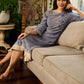 Two-tone handloom cotton dress with delicately painted Madhubani fish motifs and pleated hem.