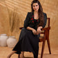 Exquisite black Ikat jacket with offset collar flaps and detailed red floral vine embroidery, delivering a sculpted, high-impact silhouette with refined presence for corporate styling.
