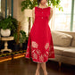 Vibrant red sleeveless dress with a bold off-white floral hand block print at the hem and clean off-white edging for a striking, handcrafted-inspired finish.