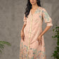 Peach Kalamkari-inspired shirt dress with soft beige accents.