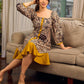 Heritage Kalamkari dress with elegant mustard accents and black pearl embellishments.