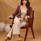 Smart maroon Ikat jacket featuring gathered sleeves, a cream notch collar, and subtle accents, creating a defined, structured silhouette suited for polished corporate wear.