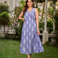 Graceful powder blue Ikat dress showcasing layered overlap details highlighted with white accents.
