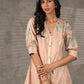 Peach Kalamkari-inspired shirt dress with soft beige accents.