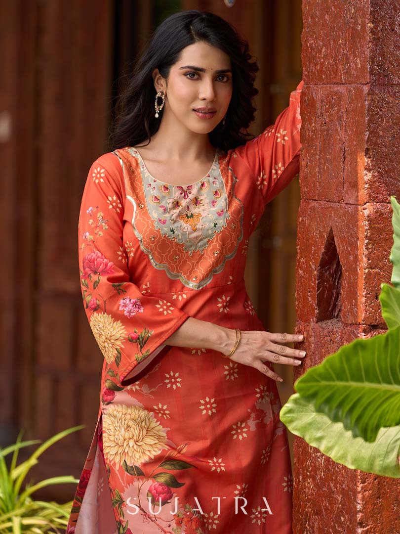 Elegant orange floral printed kurta with hand-embroidered sequin and cut dana detailing on the yoke and rich maroon accents.