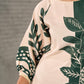 Bottle green and beige half and half dress with raglan sleeves and transitioning floral motifs.