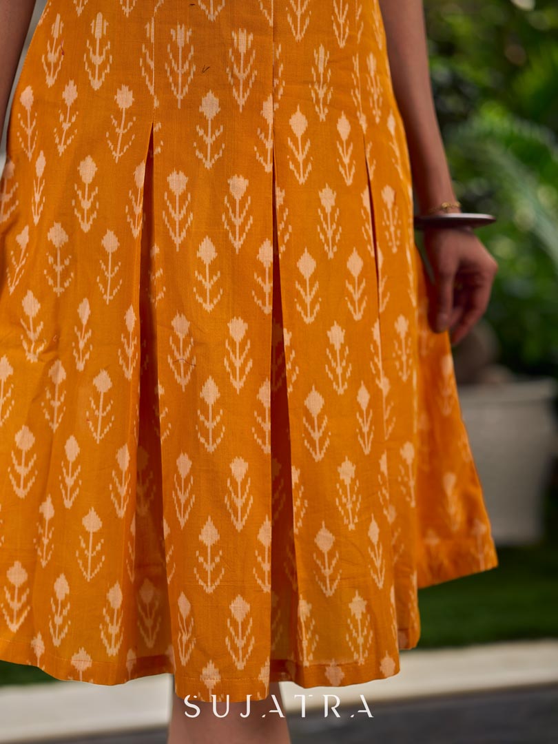 Statement mercerised mustard Ikat dress elevated with drop-shoulder styling, pleated neckline and sleeves detailing featuring soft box pleats for ease and movement