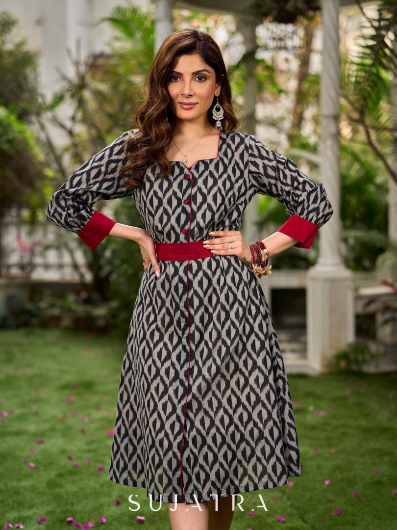 Elegant black grey mercerised Ikat shirt dress featuring a soft square neck, subtle maroon detailing, and a waist belt for a gently flowing silhouette.