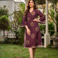 Elegant wine-purple Ikat dress with flowy sleeves, finished with a belt for a softly cinched silhouette.
