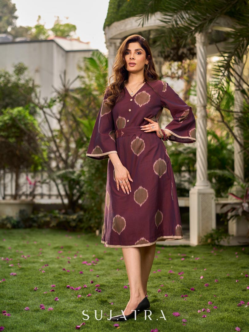 Elegant wine-purple Ikat dress with flowy sleeves, finished with a belt for a softly cinched silhouette.