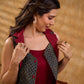 Sharp dark teal and maroon checkered sleeveless jacket with a distinctive notch collar and princess-cut tailoring, offering a structured silhouette ideal for elevated corporate styling.