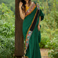 Artisanal cotton saree in bold green with Madhubani hand painted charm