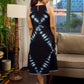 Black tie dye contemporary sleeveless dress with a bold, symmetrical dye pattern.