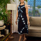 Black tie dye contemporary sleeveless dress with a bold, symmetrical dye pattern.