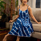 Beautiful blue shibori tie dye slip dress featuring handcrafted patterns and elegant lace accents.
