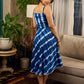 Beautiful blue shibori tie dye slip dress featuring handcrafted patterns and elegant lace accents.