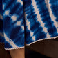 Beautiful blue shibori tie dye slip dress featuring handcrafted patterns and elegant lace accents.