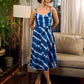 Beautiful blue shibori tie dye slip dress featuring handcrafted patterns and elegant lace accents.