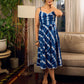 Beautiful blue shibori tie dye slip dress featuring handcrafted patterns and elegant lace accents.