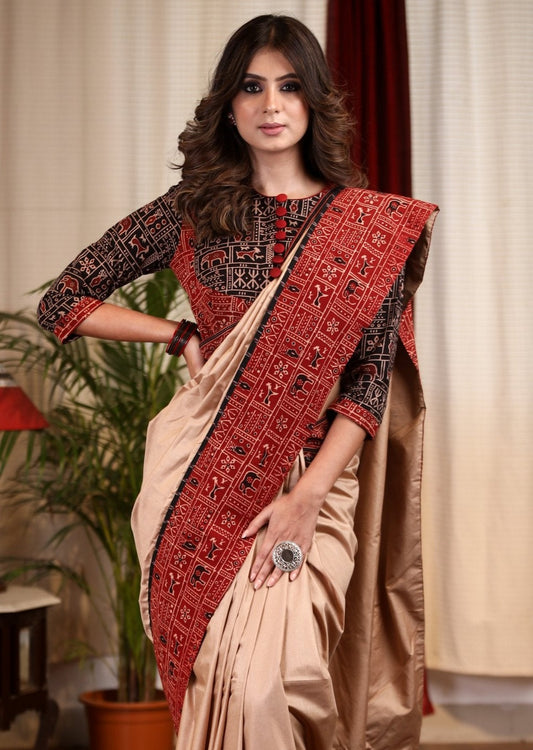 Beige silk cotton saree with block printed Ajrakh border