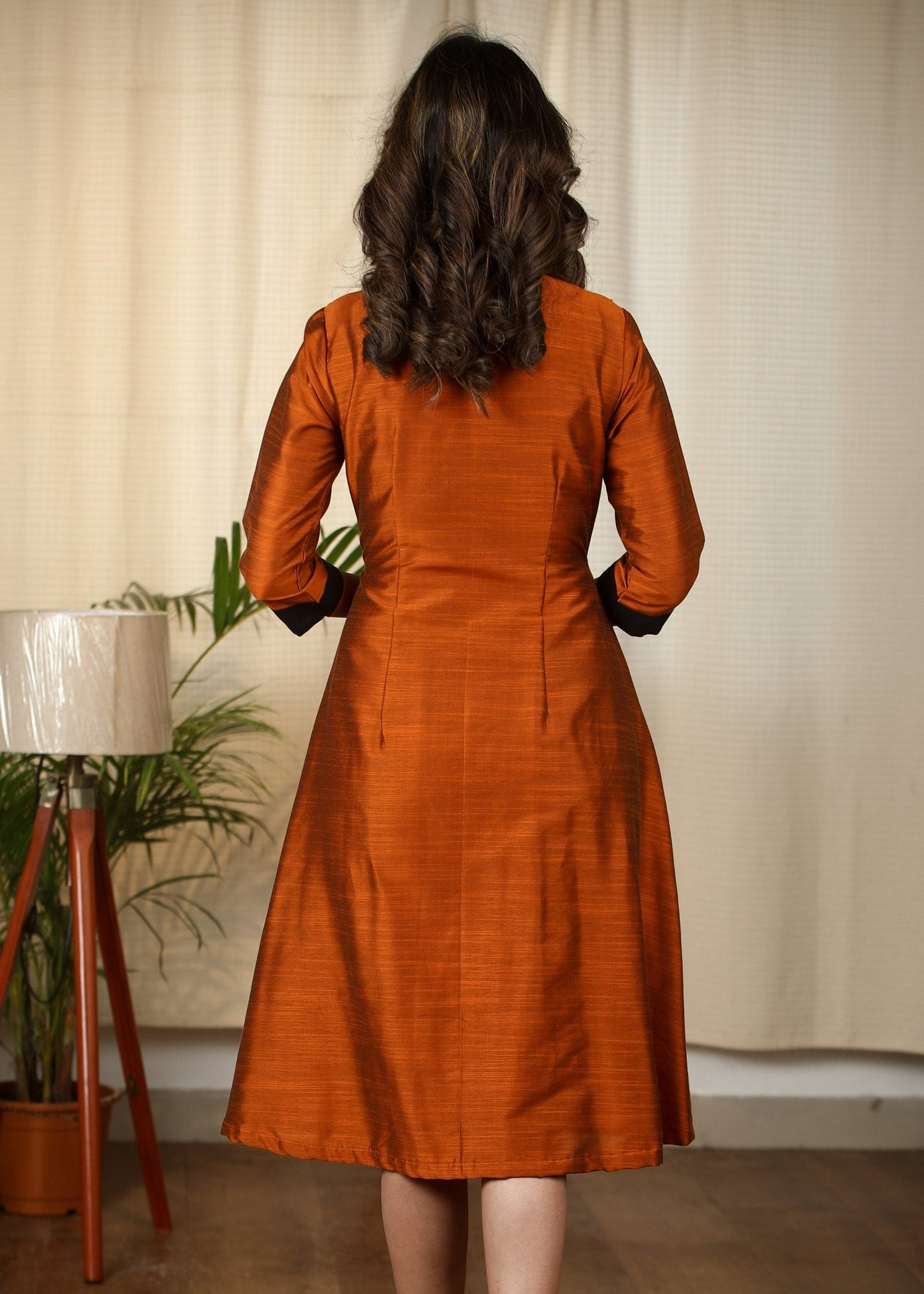 Exclusive Rust cotton silk dress with intricate hand embroidered motif