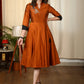 Exclusive Rust cotton silk dress with intricate hand embroidered motif