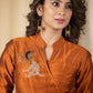 Exclusive Rust cotton silk dress with intricate hand embroidered motif