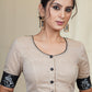 Beige Handloom Cotton Blouse With Hand Painted Motifs at the Back and sleeves and potli work