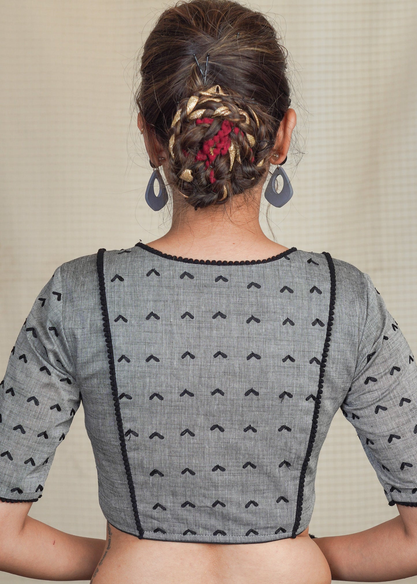 Grey Cotton Handloom Blouse with  Embroidery work all over and pom pom lace . Lining Given
