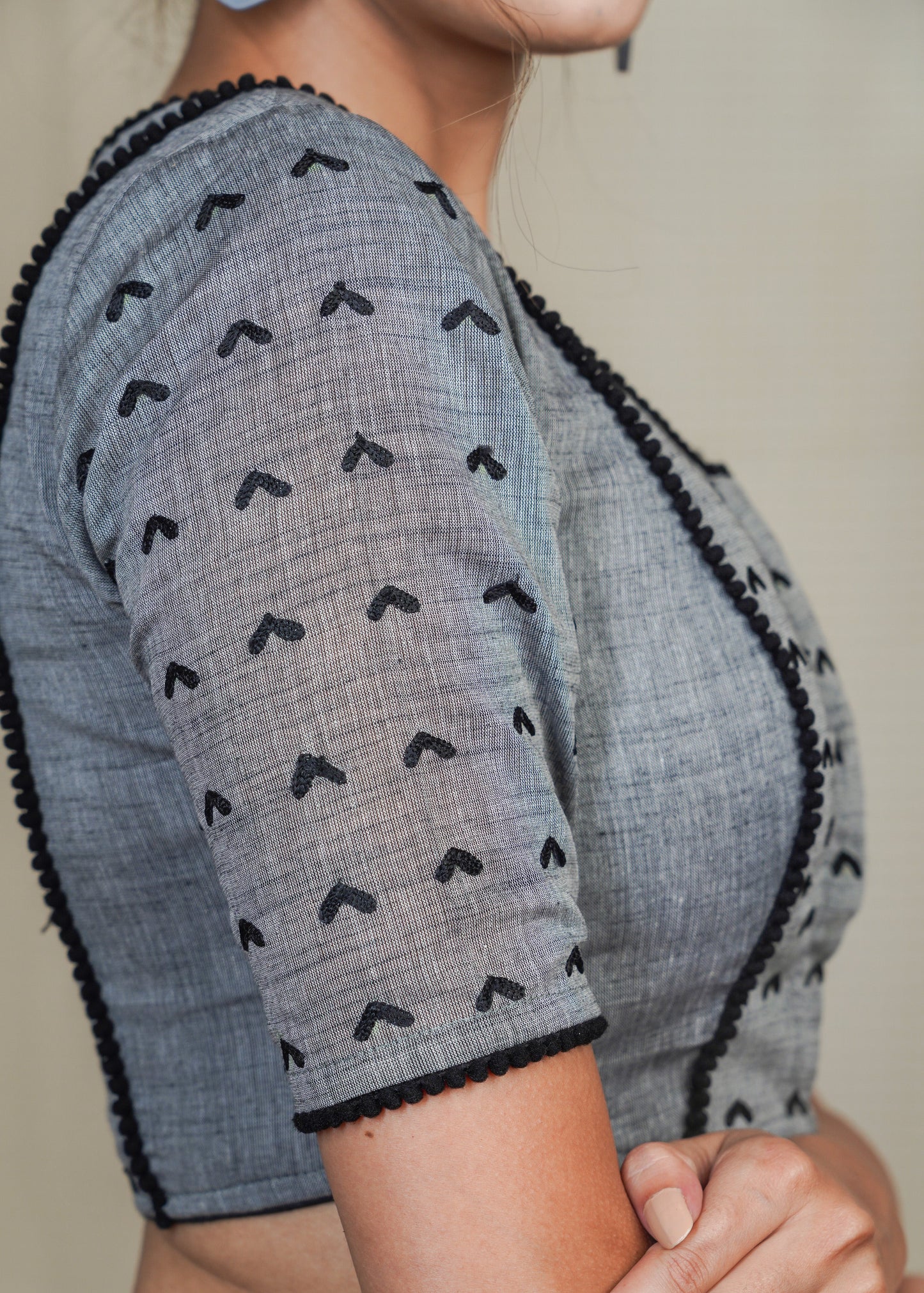 Grey Cotton Handloom Blouse with  Embroidery work all over and pom pom lace . Lining Given