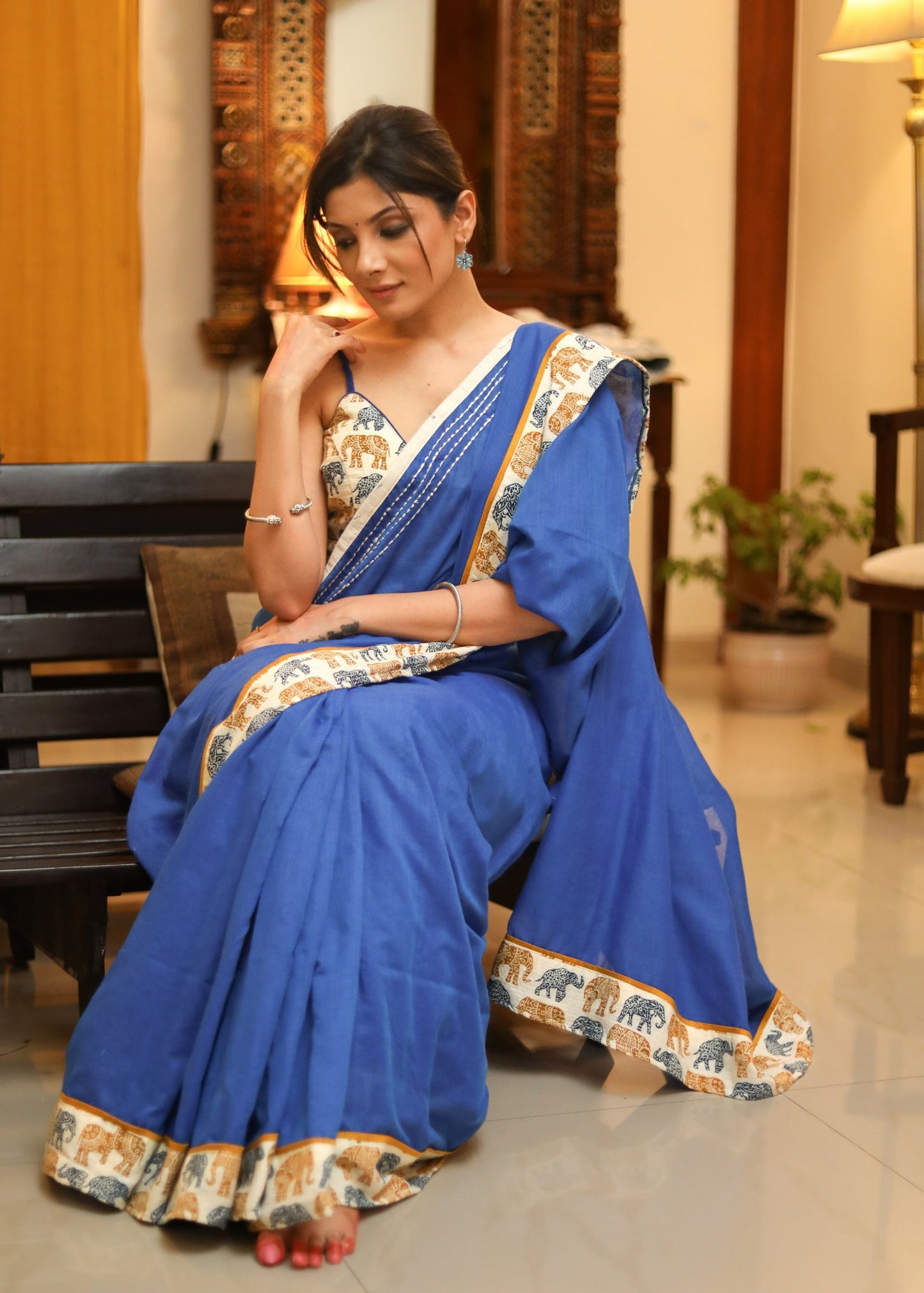 Bright blue Cotton saree with elephant print border and white lines