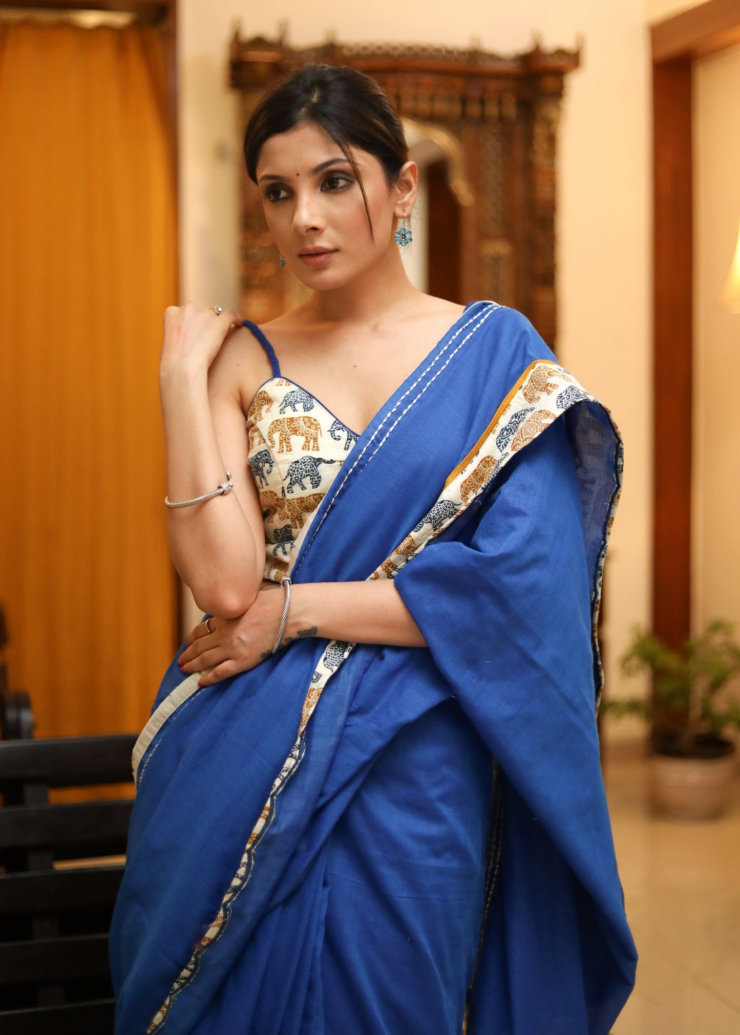 Bright blue Cotton saree with elephant print border and white lines